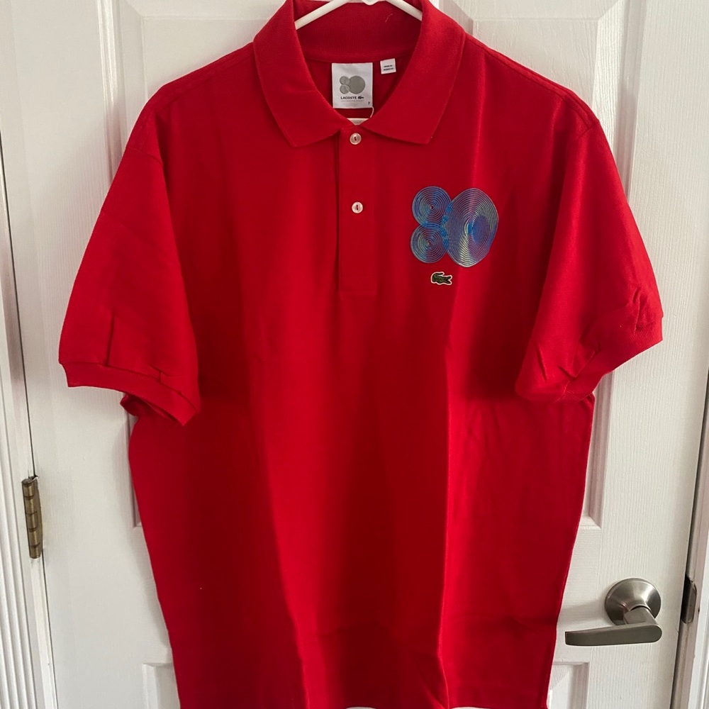 Men’s Lacoste Button up collard polo tee.